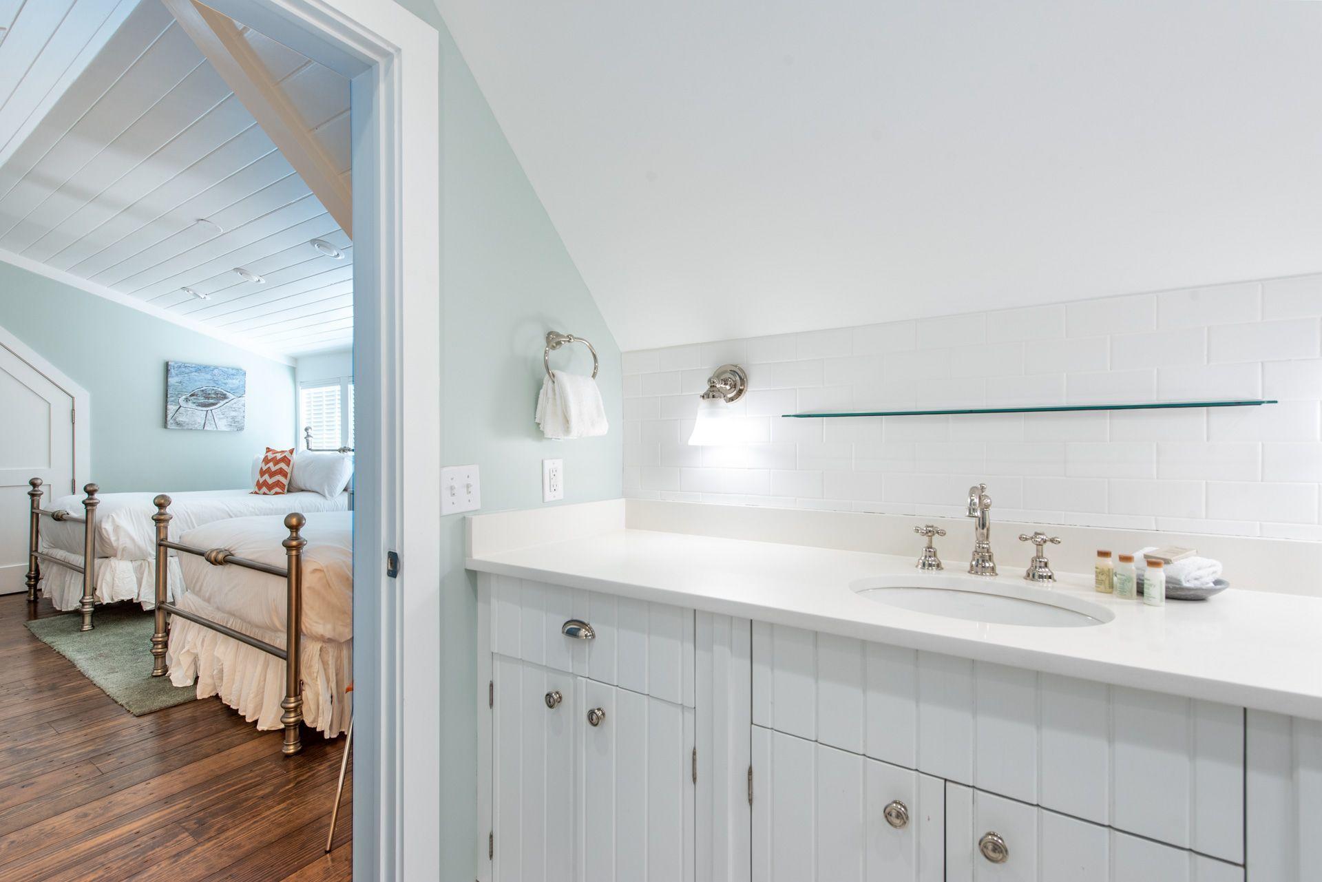 287 Salt Lane Watersound, FL 32461 - Photo 29 of 38 a en suite bathroom with a sink and mirror