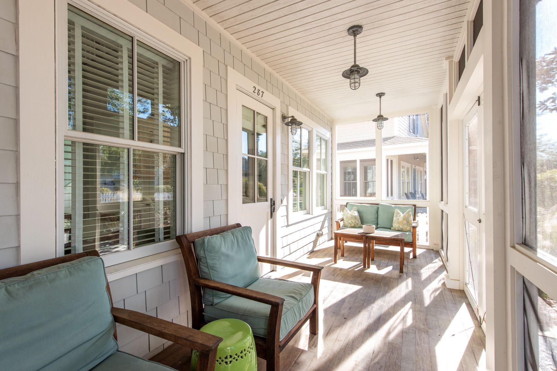 287 Salt Lane Watersound, FL 32461 - Photo 32 of 38 a view of a dining room with furniture wooden floor and a chandelier