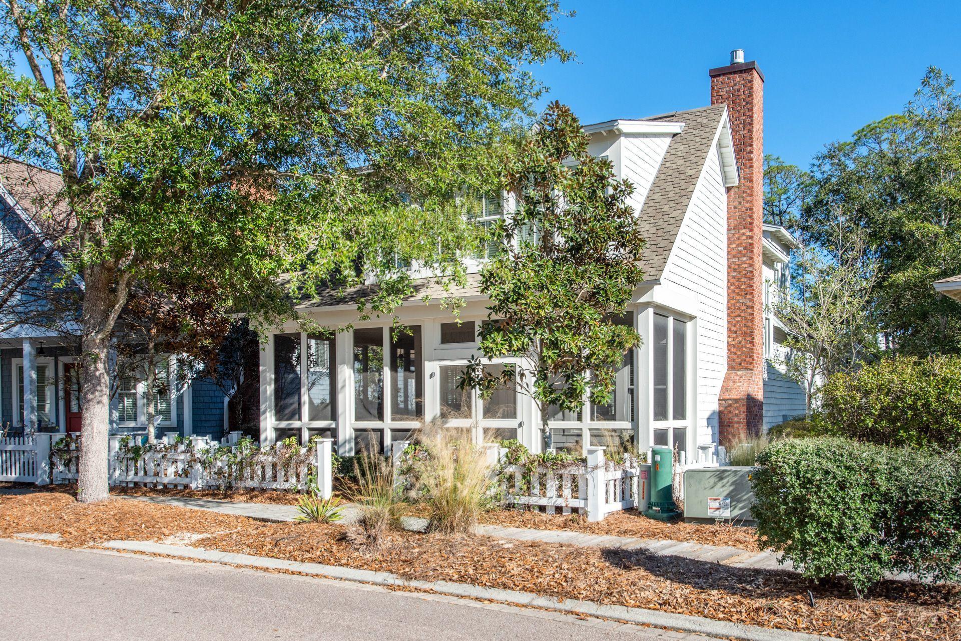 287 Salt Lane Watersound, FL 32461 - Photo 35 of 38 a view of a house with a patio and a yard