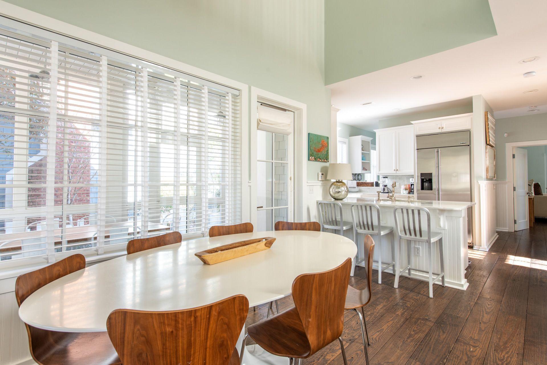 287 Salt Lane Watersound, FL 32461 - Photo 4 of 38 a dining room with furniture a large window and kitchen view