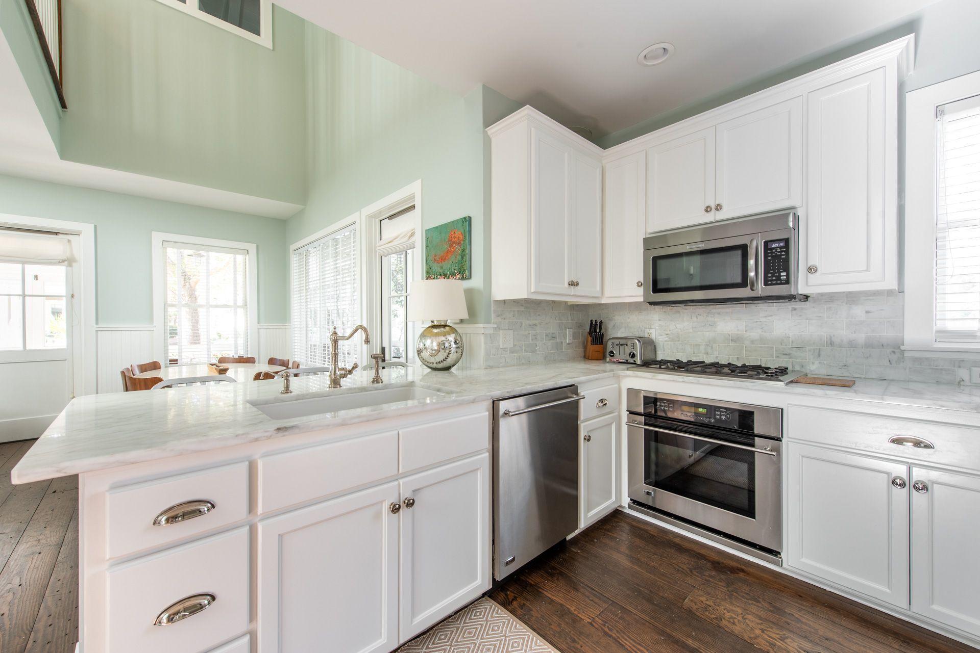 287 Salt Lane Watersound, FL 32461 - Photo 7 of 38 a kitchen with a sink stove and microwave