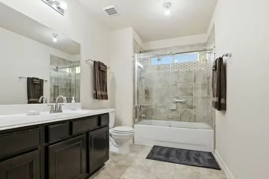 a bathroom with a bathtub a sink and mirror