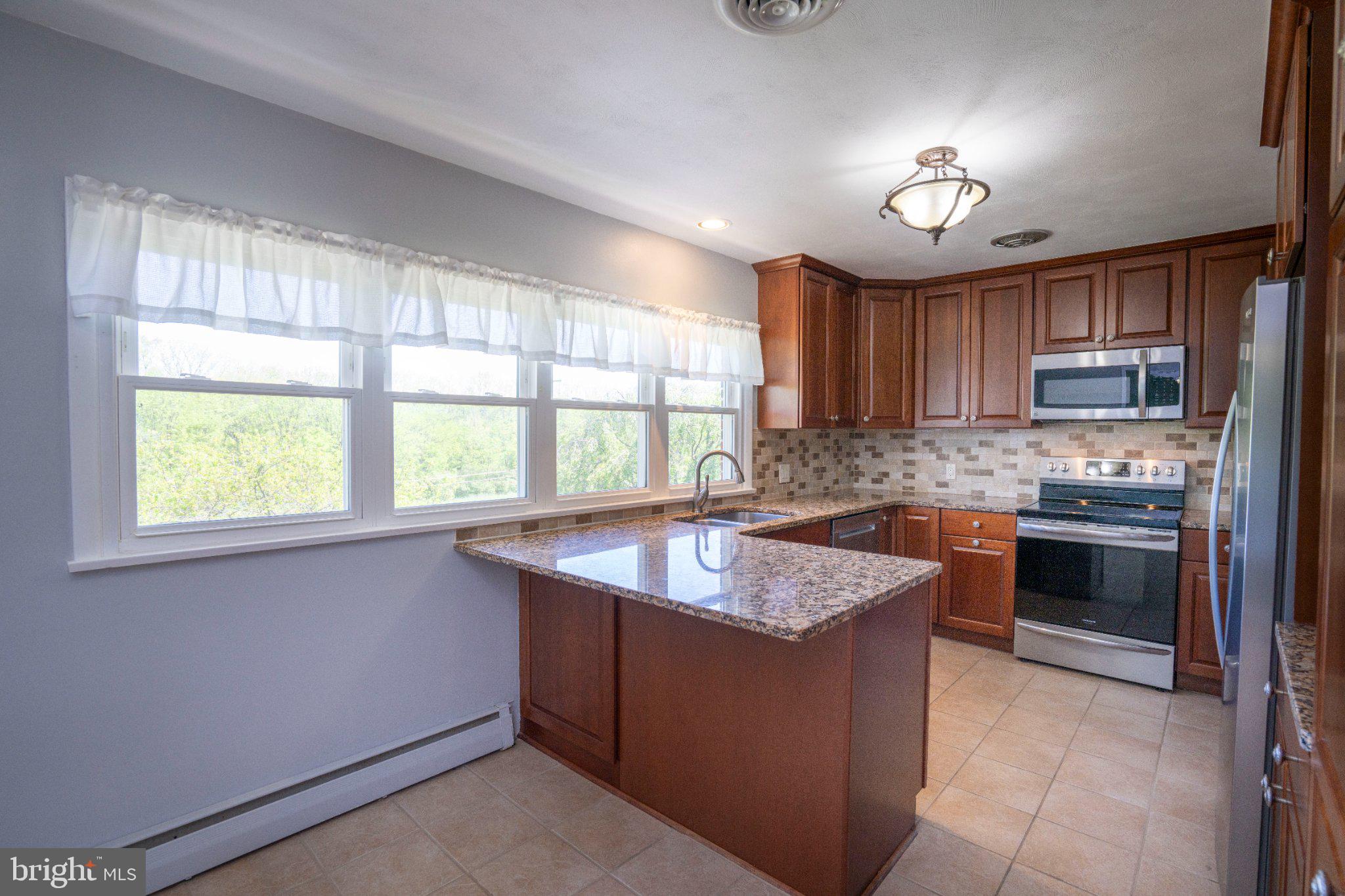 1639 Houserville Road State College, PA 16801 - Photo 19 of 54 Bright and inviting modern kitchen.