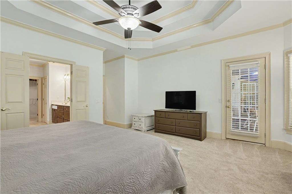 537 Old Collins Road Hoschton, GA 30548 - Photo 19 of 42 an empty room with furniture and a flat screen tv