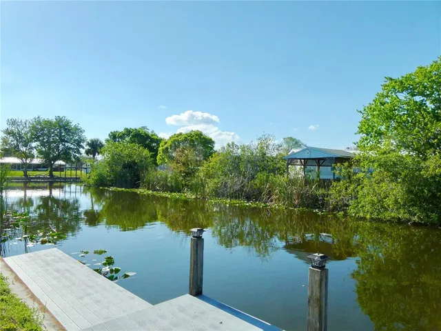 a view of a lake with a building in the background