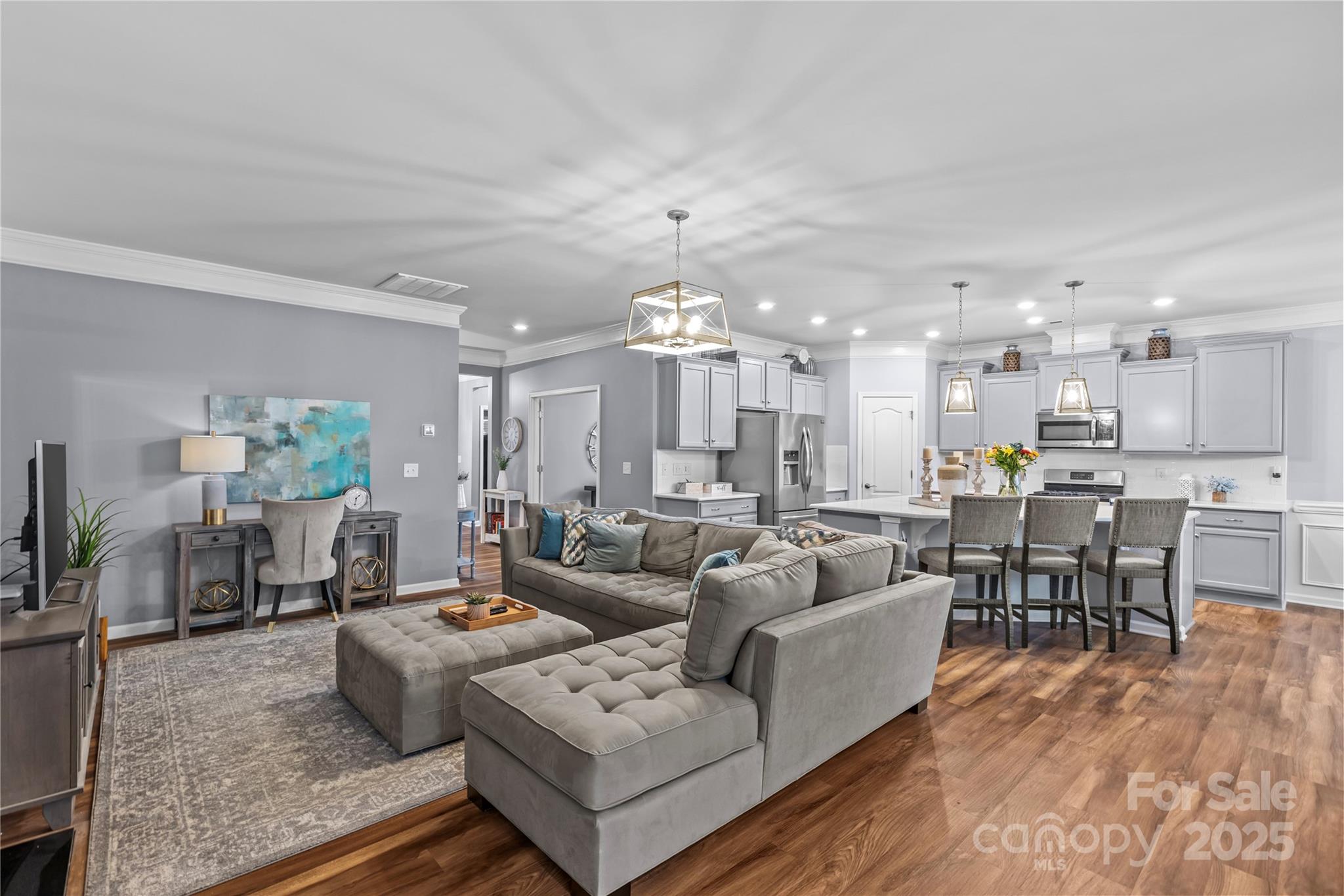 8097 Asher Chase Trail Lancaster, SC 29720 - Photo 12 of 47 a living room with furniture kitchen view and a chandelier