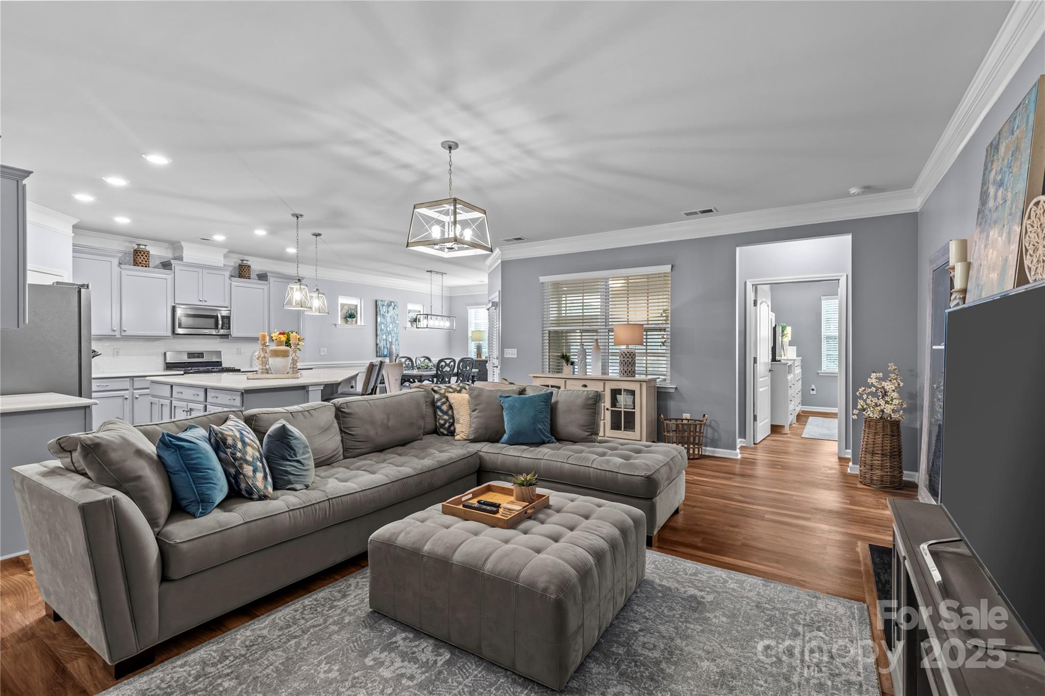 8097 Asher Chase Trail Lancaster, SC 29720 - Photo 17 of 47 a living room with furniture and a chandelier