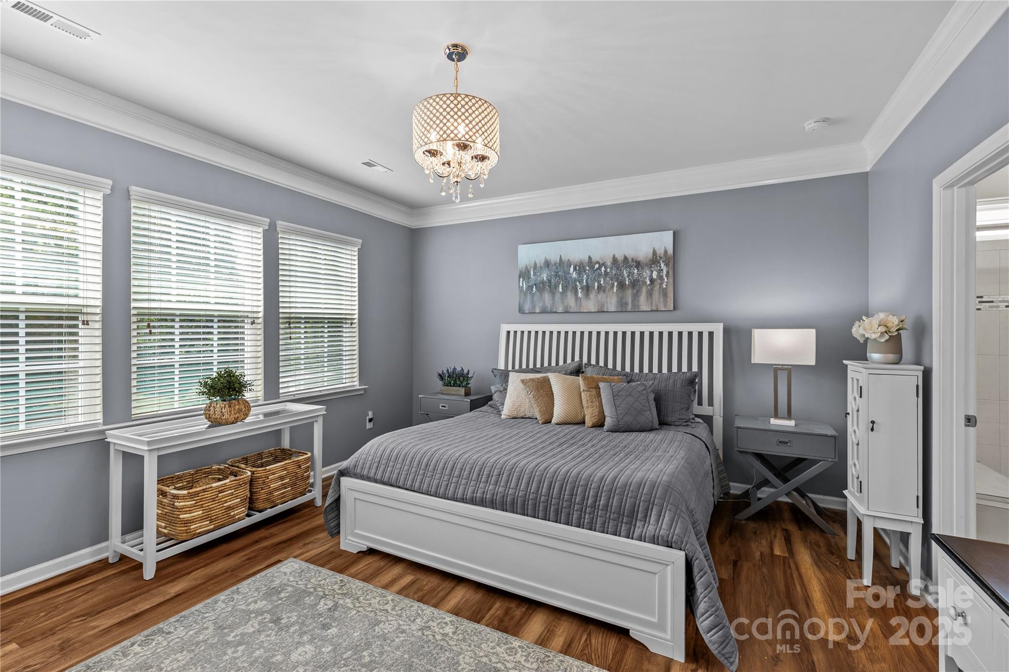 8097 Asher Chase Trail Lancaster, SC 29720 - Photo 21 of 47 a bedroom with a bed and a chandelier