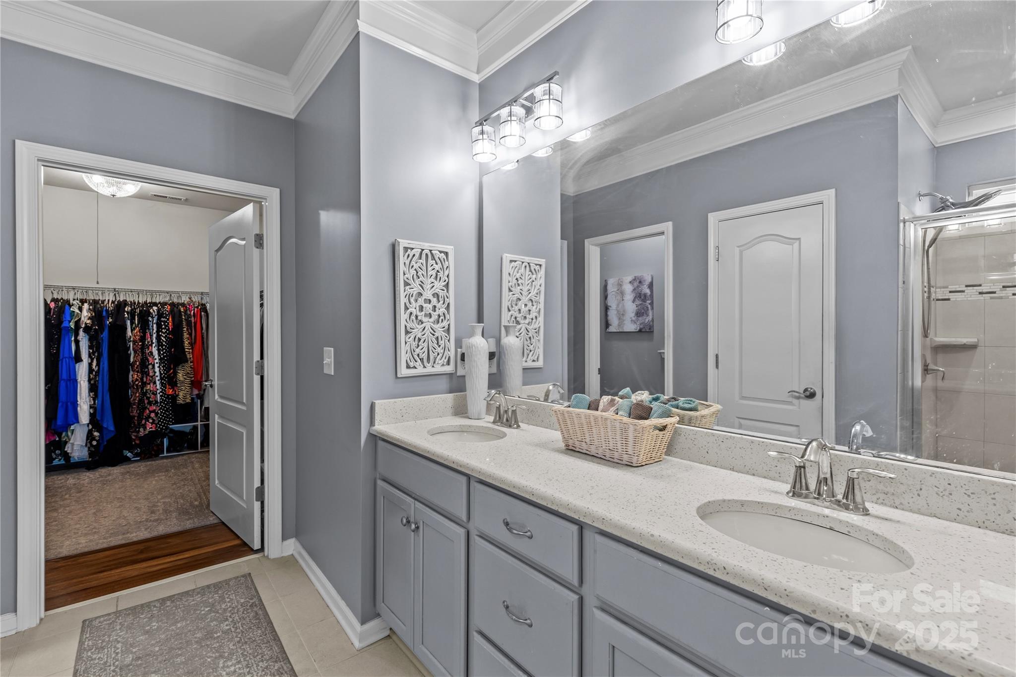 8097 Asher Chase Trail Lancaster, SC 29720 - Photo 24 of 47 a en suite bathroom with double sink and a mirror