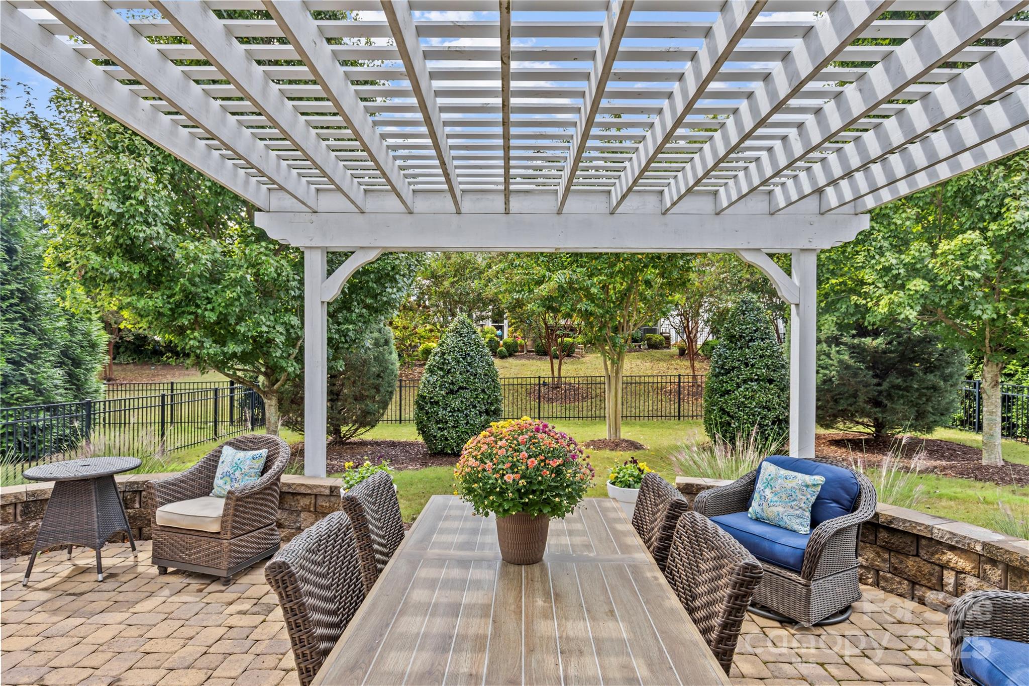 8097 Asher Chase Trail Lancaster, SC 29720 - Photo 30 of 47 a view of a patio with couches chairs and wooden floor