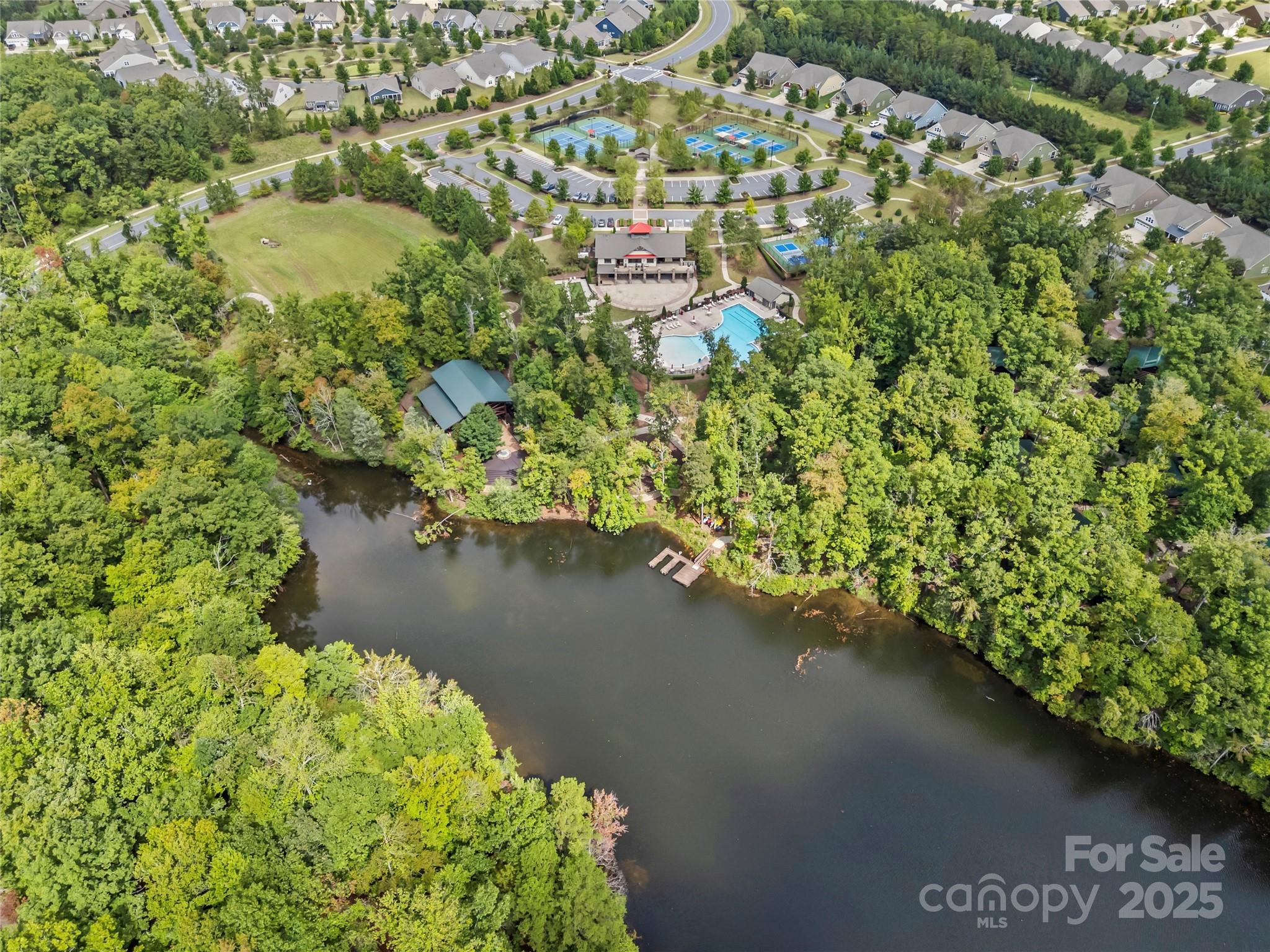 8097 Asher Chase Trail Lancaster, SC 29720 - Photo 35 of 47 a view of a lake with a yard