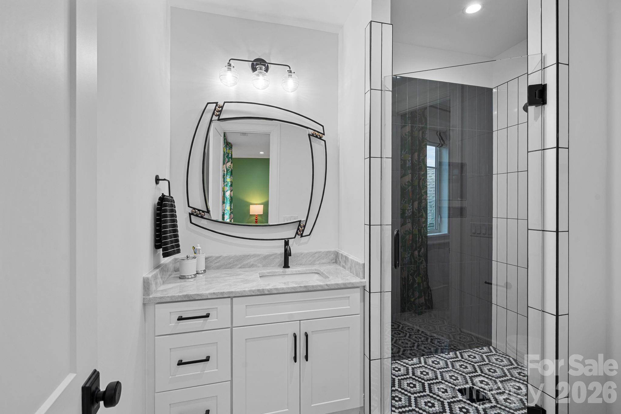 5907 Kiowa Road Clover, SC 29710 - Photo 20 of 47 a bathroom with a sink vanity and a mirror