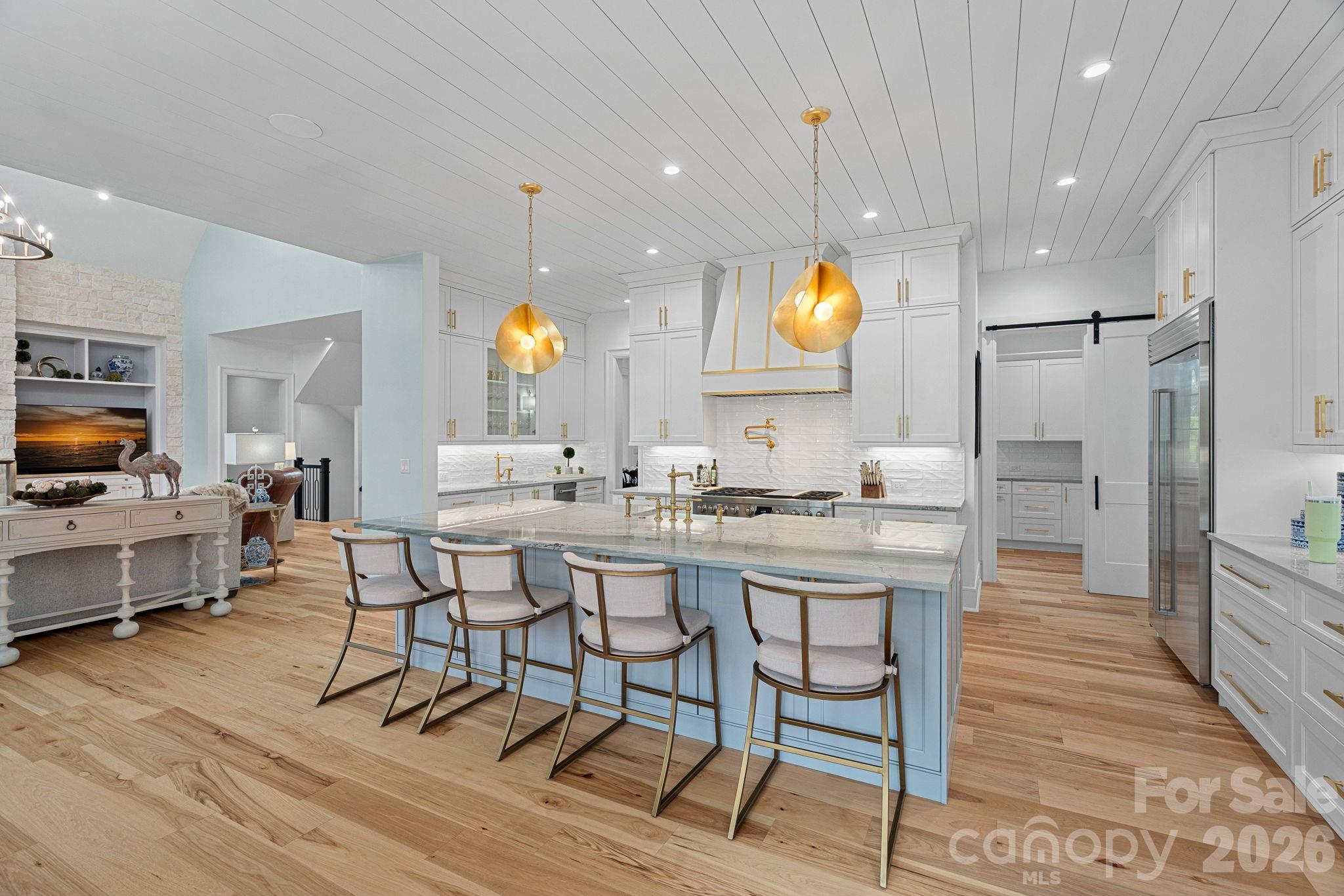 5907 Kiowa Road Clover, SC 29710 - Photo 24 of 47 a kitchen with counter and chairs in it