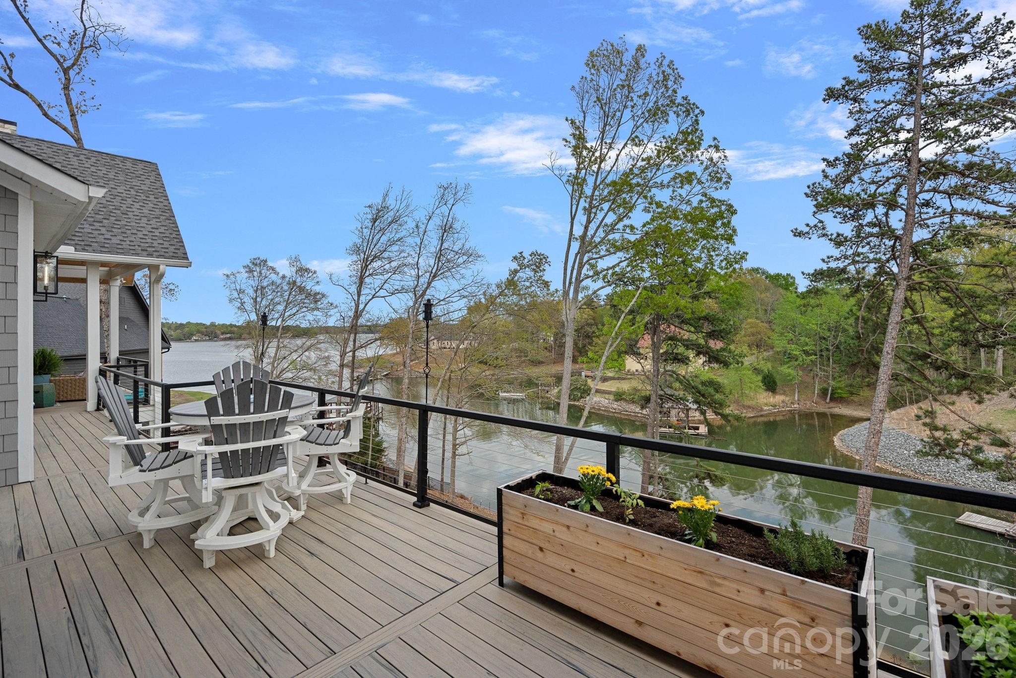 5907 Kiowa Road Clover, SC 29710 - Photo 33 of 47 a view of a balcony with chairs and wooden floor