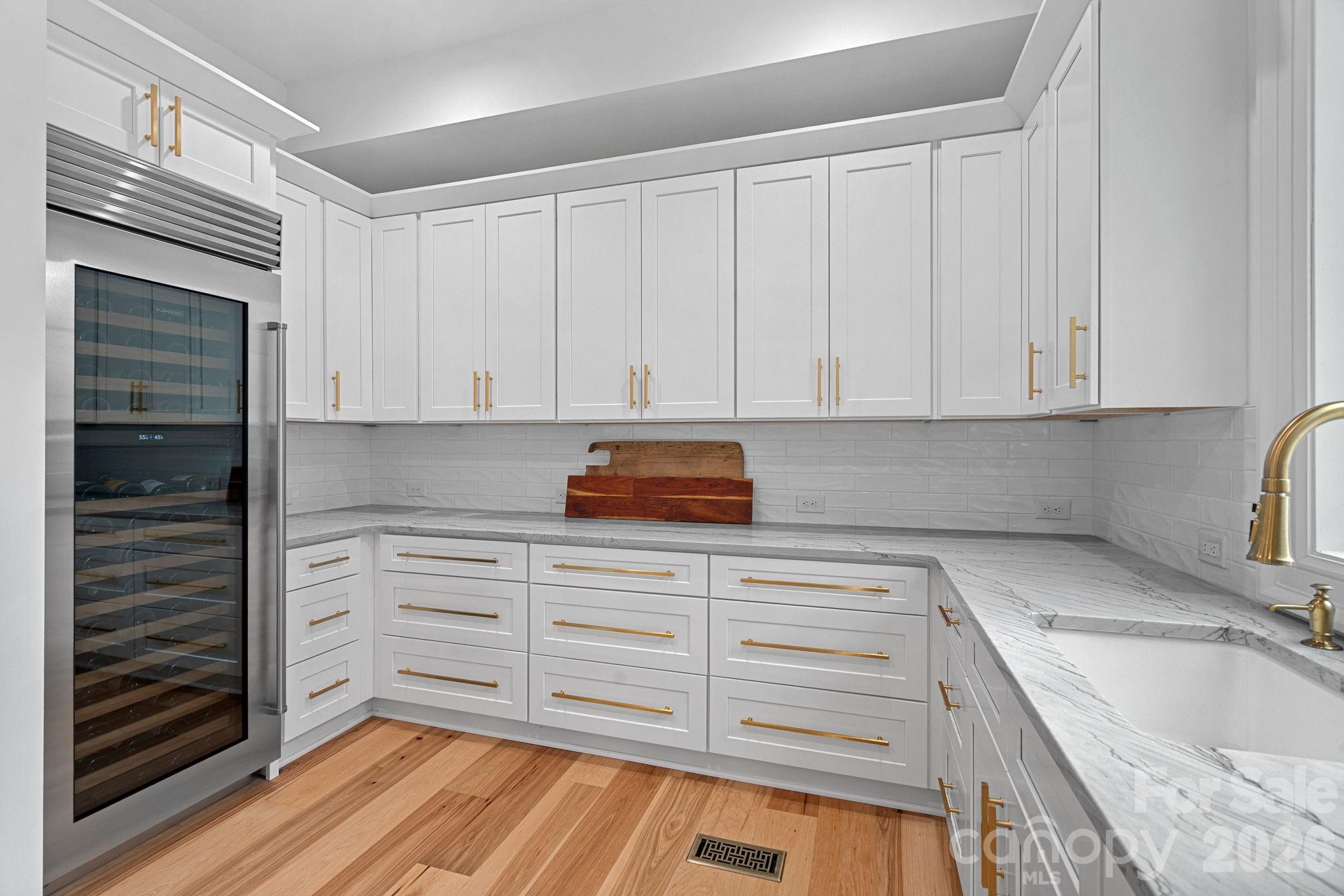5907 Kiowa Road Clover, SC 29710 - Photo 8 of 47 a kitchen with granite countertop white cabinets and sink