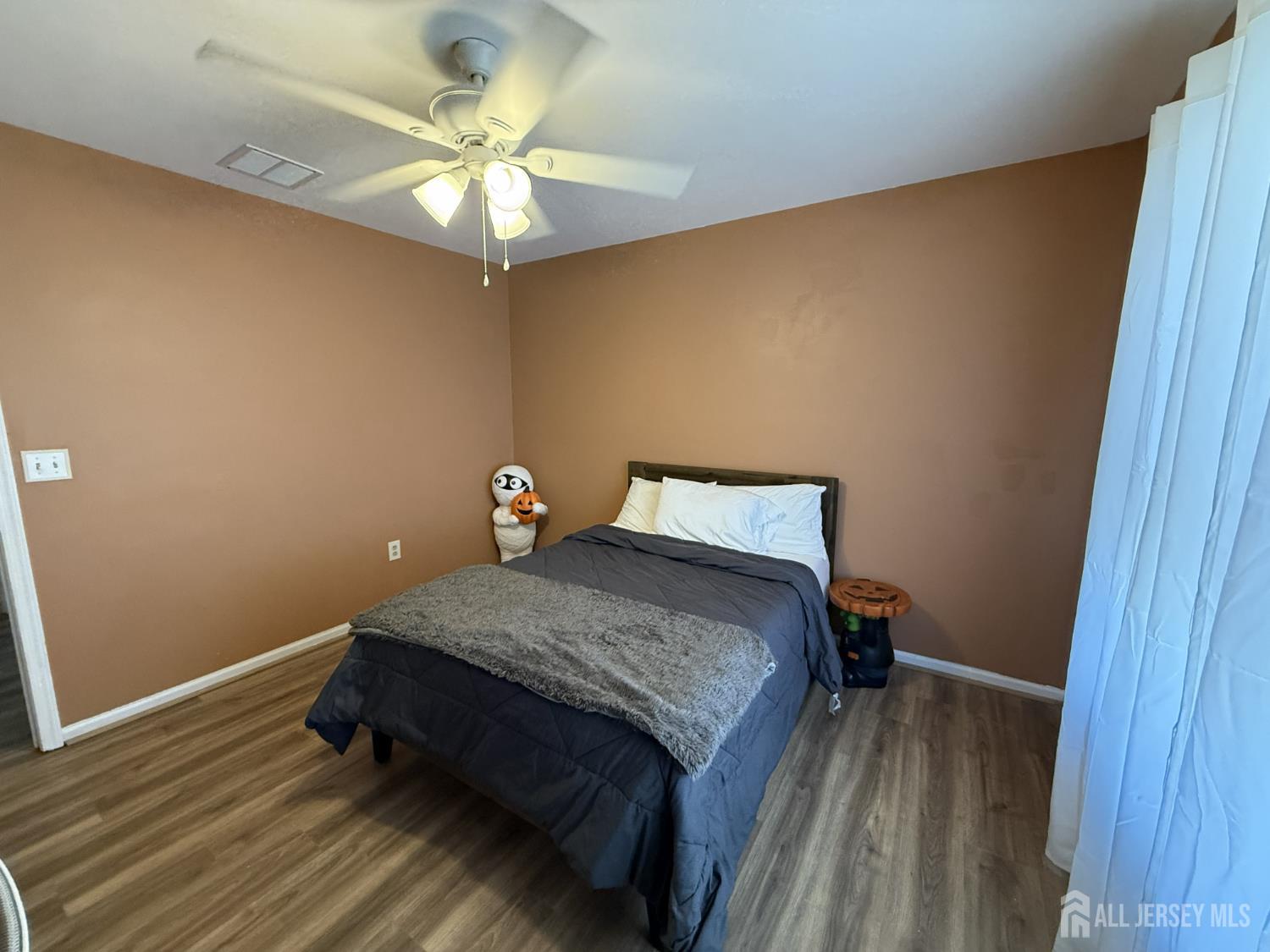 15 Sutton Place Helmetta, NJ 08828 - Photo 12 of 27 a bedroom with a bed and a ceiling fan