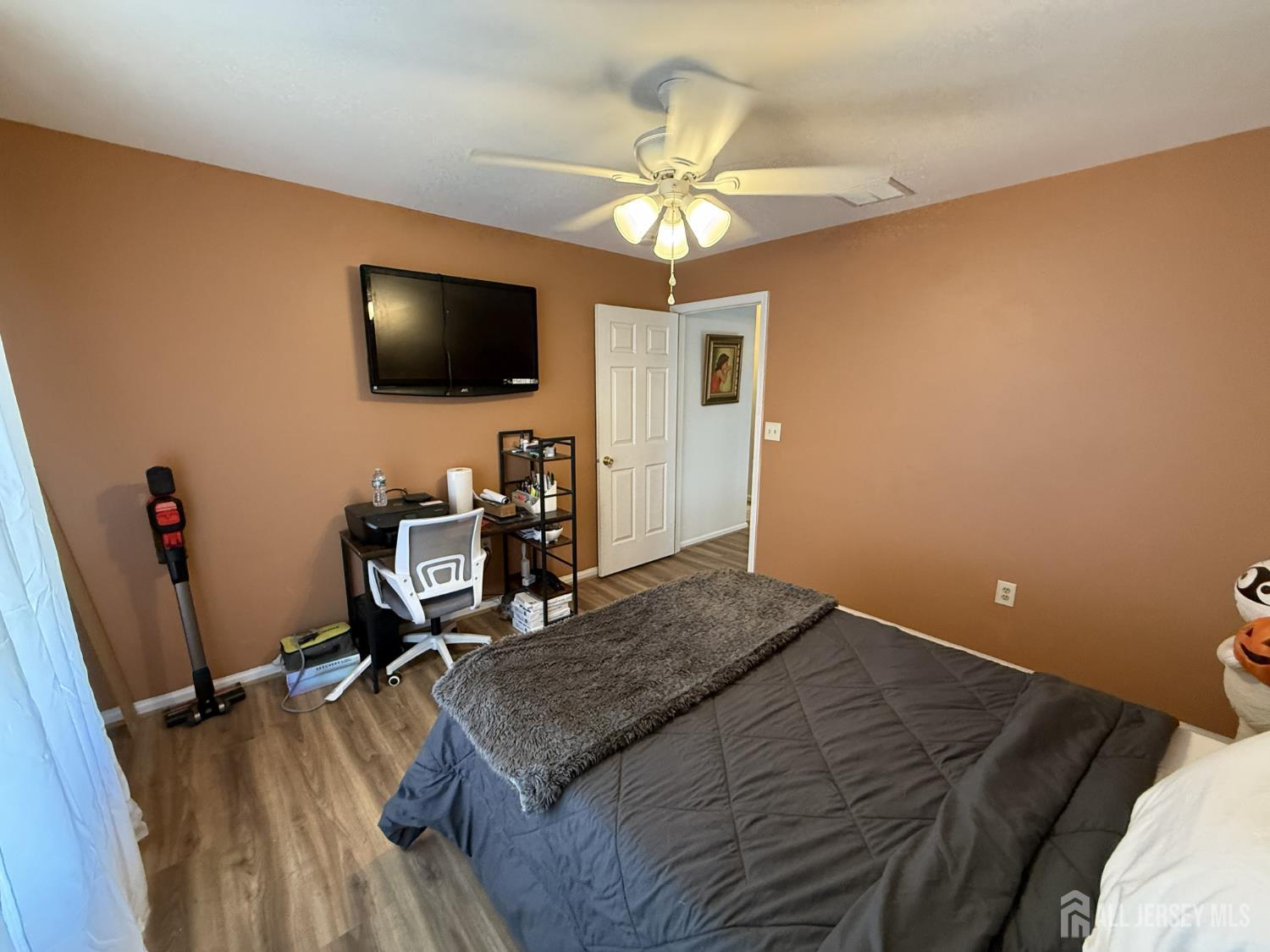 15 Sutton Place Helmetta, NJ 08828 - Photo 13 of 27 a bedroom with a bed and a flat screen tv