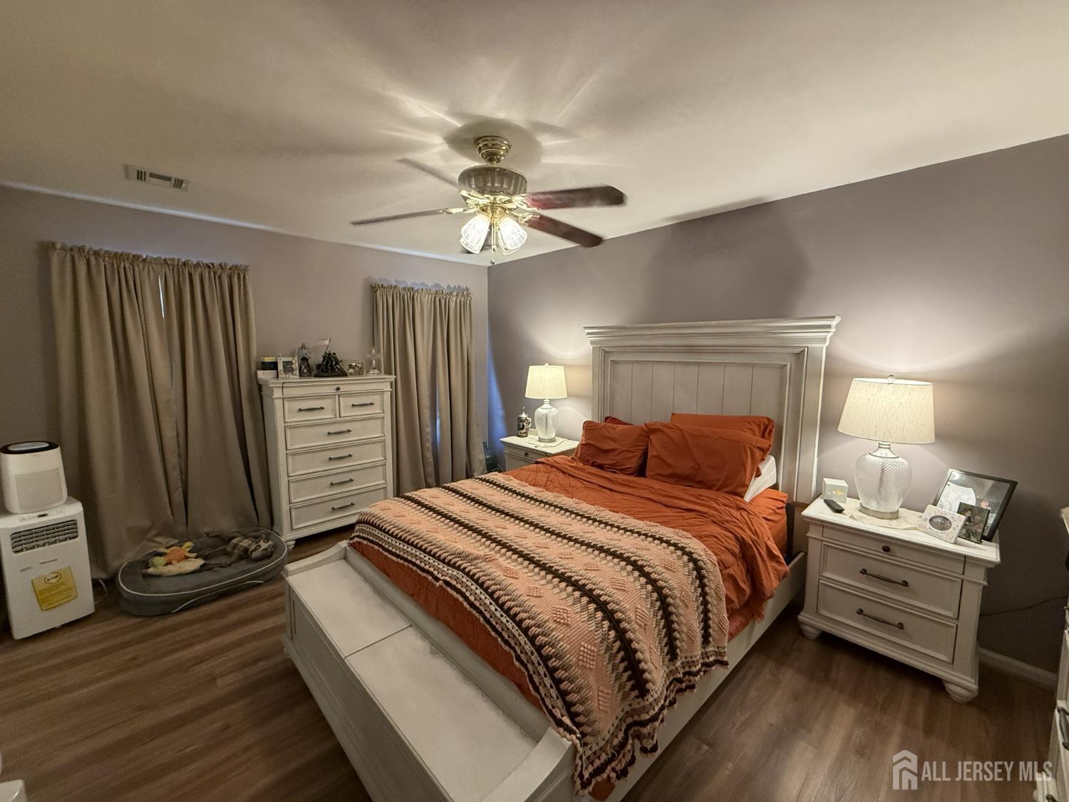 15 Sutton Place Helmetta, NJ 08828 - Photo 14 of 27 a bedroom with a bed and a chandelier