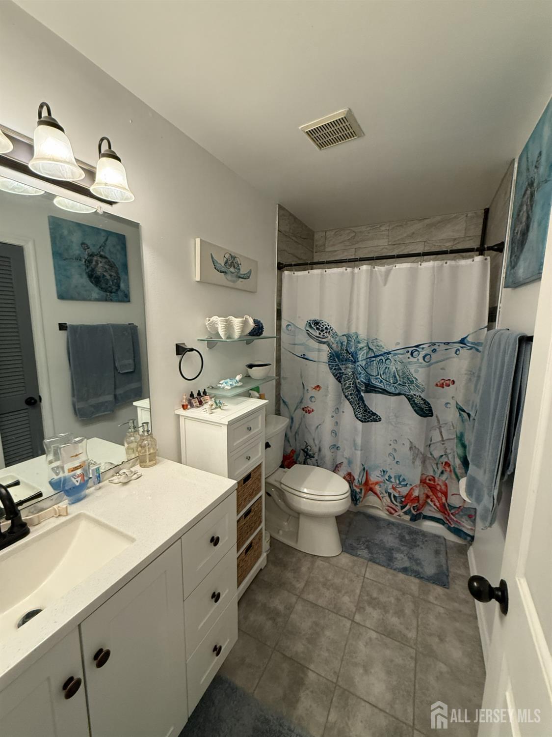 15 Sutton Place Helmetta, NJ 08828 - Photo 18 of 27 a bathroom with a sink mirror and toilet