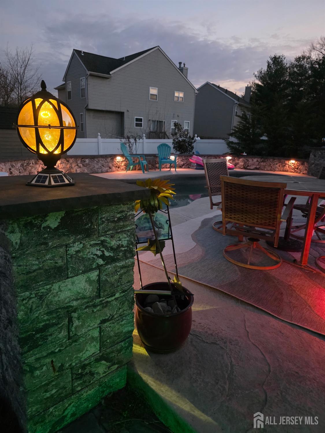 15 Sutton Place Helmetta, NJ 08828 - Photo 25 of 27 a backyard of a house with table and chairs