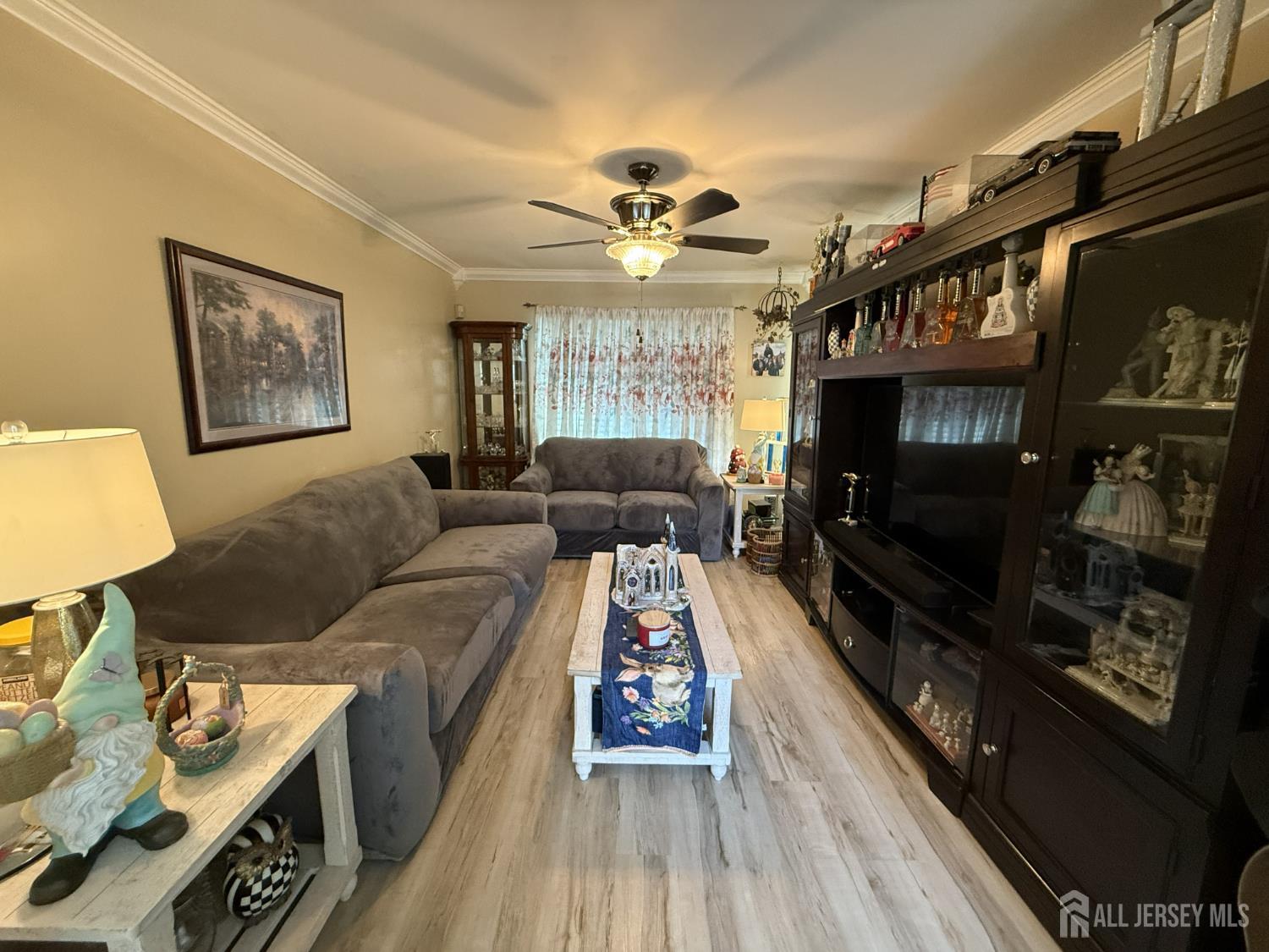 15 Sutton Place Helmetta, NJ 08828 - Photo 6 of 27 a living room with furniture and a flat screen tv