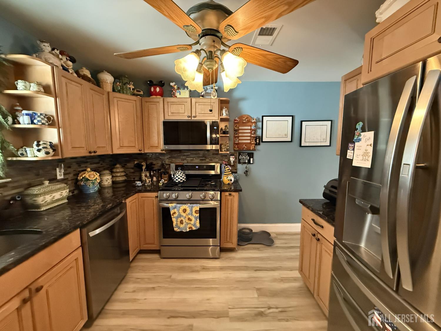15 Sutton Place Helmetta, NJ 08828 - Photo 10 of 27 a kitchen with stainless steel appliances granite countertop a refrigerator a stove top oven a sink and dishwasher