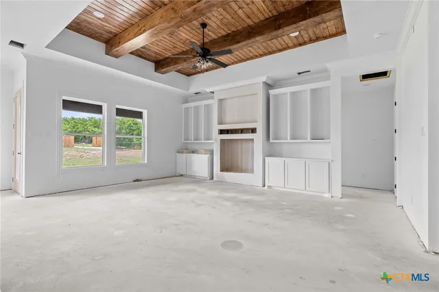 a view of a kitchen with furniture and windows