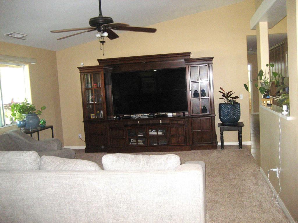 29175 The Yellow Brick Road Valley Center, CA 92082 - Photo 12 of 17 a living room with furniture and a flat screen tv