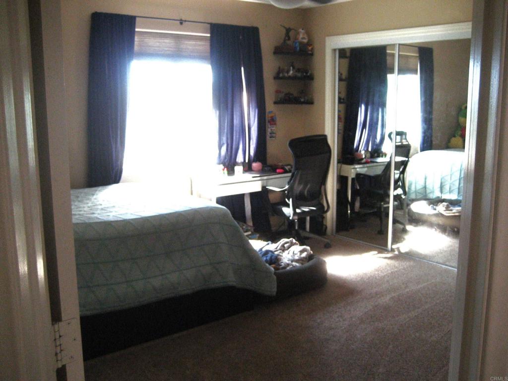 29175 The Yellow Brick Road Valley Center, CA 92082 - Photo 14 of 17 a living room with furniture flowerpot and a mirror