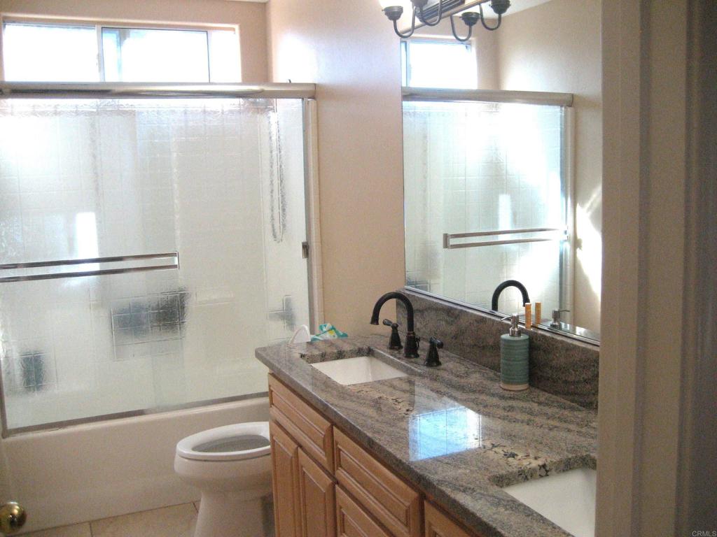 29175 The Yellow Brick Road Valley Center, CA 92082 - Photo 16 of 17 a bathroom with a granite countertop sink toilet and shower