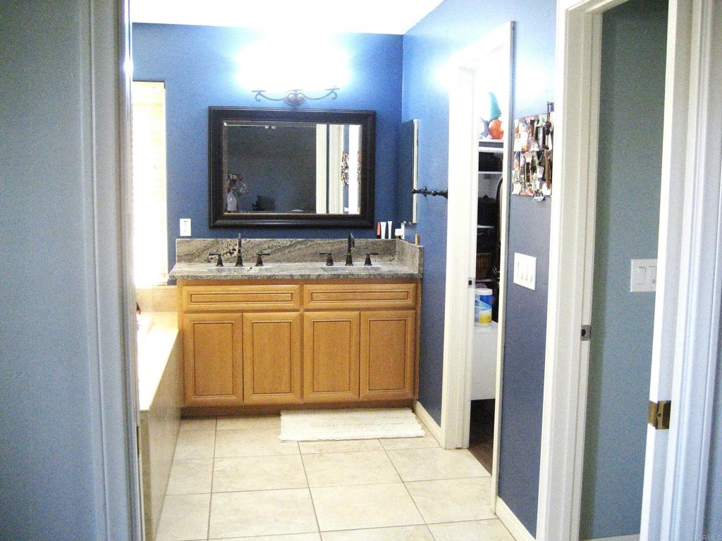 29175 The Yellow Brick Road Valley Center, CA 92082 - Photo 17 of 17 a bathroom with a sink a mirror and a bathtub