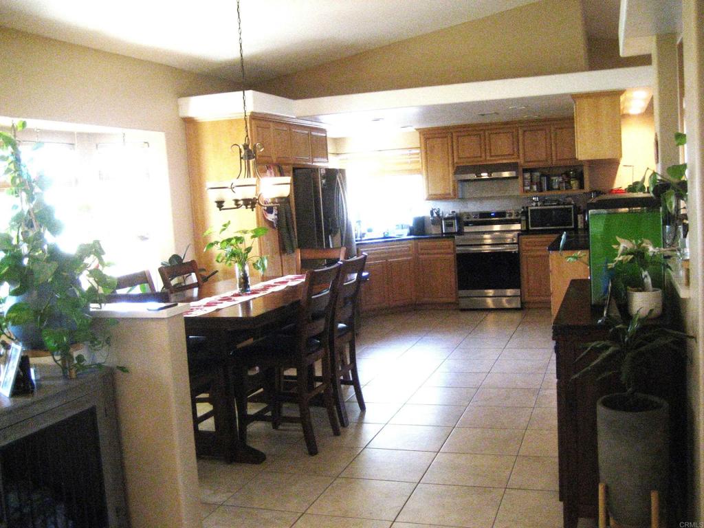 29175 The Yellow Brick Road Valley Center, CA 92082 - Photo 7 of 17 a kitchen with a sink a counter top space appliances and cabinets