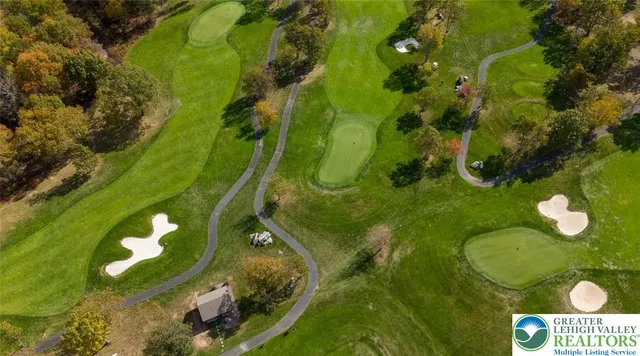 a group of people sitting in living room with stainless steel appliances with wooden floor