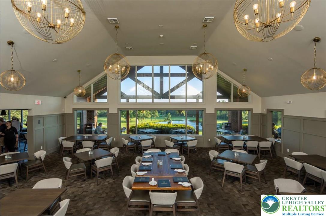 0 Rock Crest Drive Hazleton, PA 18202 - Photo 20 of 42 a living room with furniture a chandelier and a large window