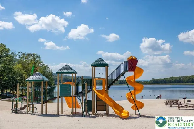 a view of a lake in middle of forest