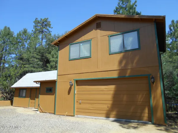 a front view of a house with a garage