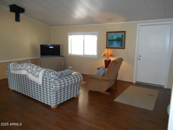 a living room with furniture and a window