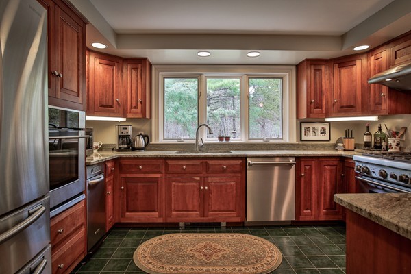 196 Middle Road Newbury, MA 01922 - Photo 10 of 28 a kitchen with a sink stove and cabinets