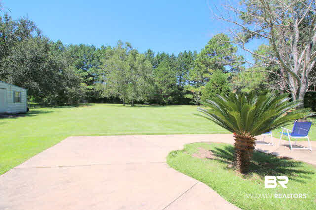 16809 River Park Road Fairhope, AL 36532 - Photo 2 of 18 Nice and simple landscaping and this awesome Sago.