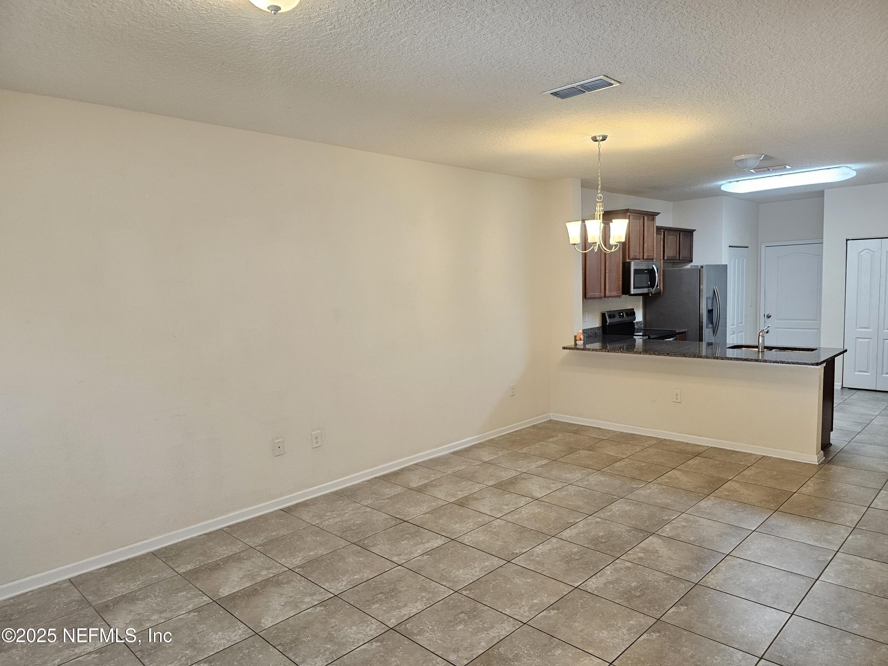 444 Servia Drive St. Johns, FL 32259 - Photo 12 of 16 Living room to kitchen