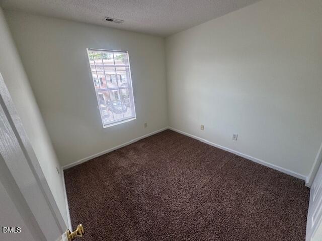 3363 Bridgeville Road Raleigh, NC 27610 - Photo 9 of 10 an empty room with windows