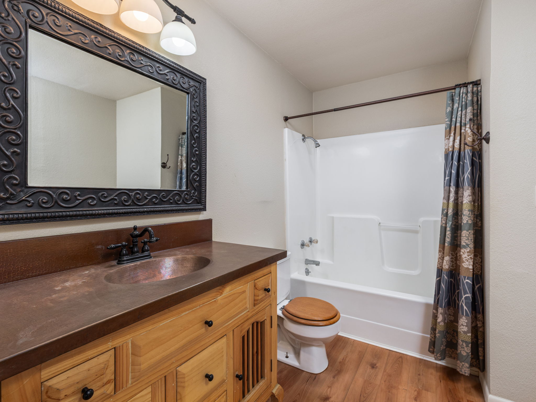 1949 County Road 347 Loop Gause, TX 77857 - Photo 14 of 32 a bathroom with a sink a toilet a mirror and shower