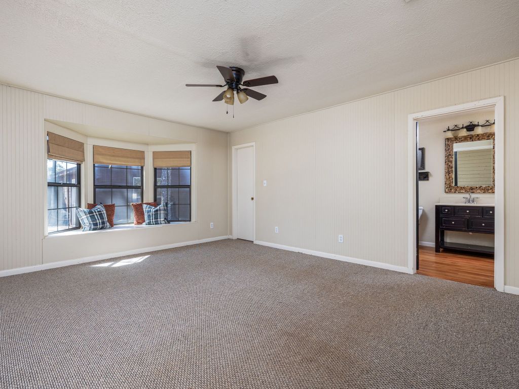 1949 County Road 347 Loop Gause, TX 77857 - Photo 15 of 32 a view of an empty room with a window and a kitchen