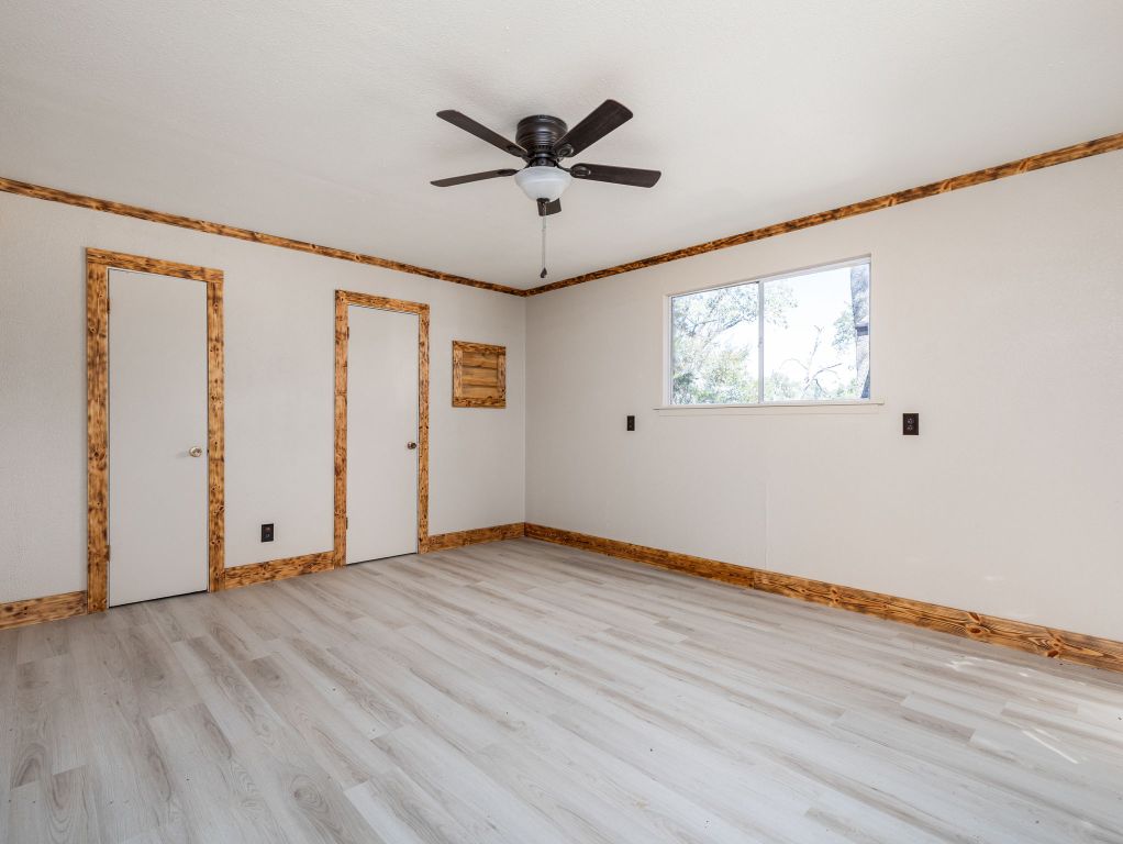 1949 County Road 347 Loop Gause, TX 77857 - Photo 19 of 32 wooden floor in an empty room with a window