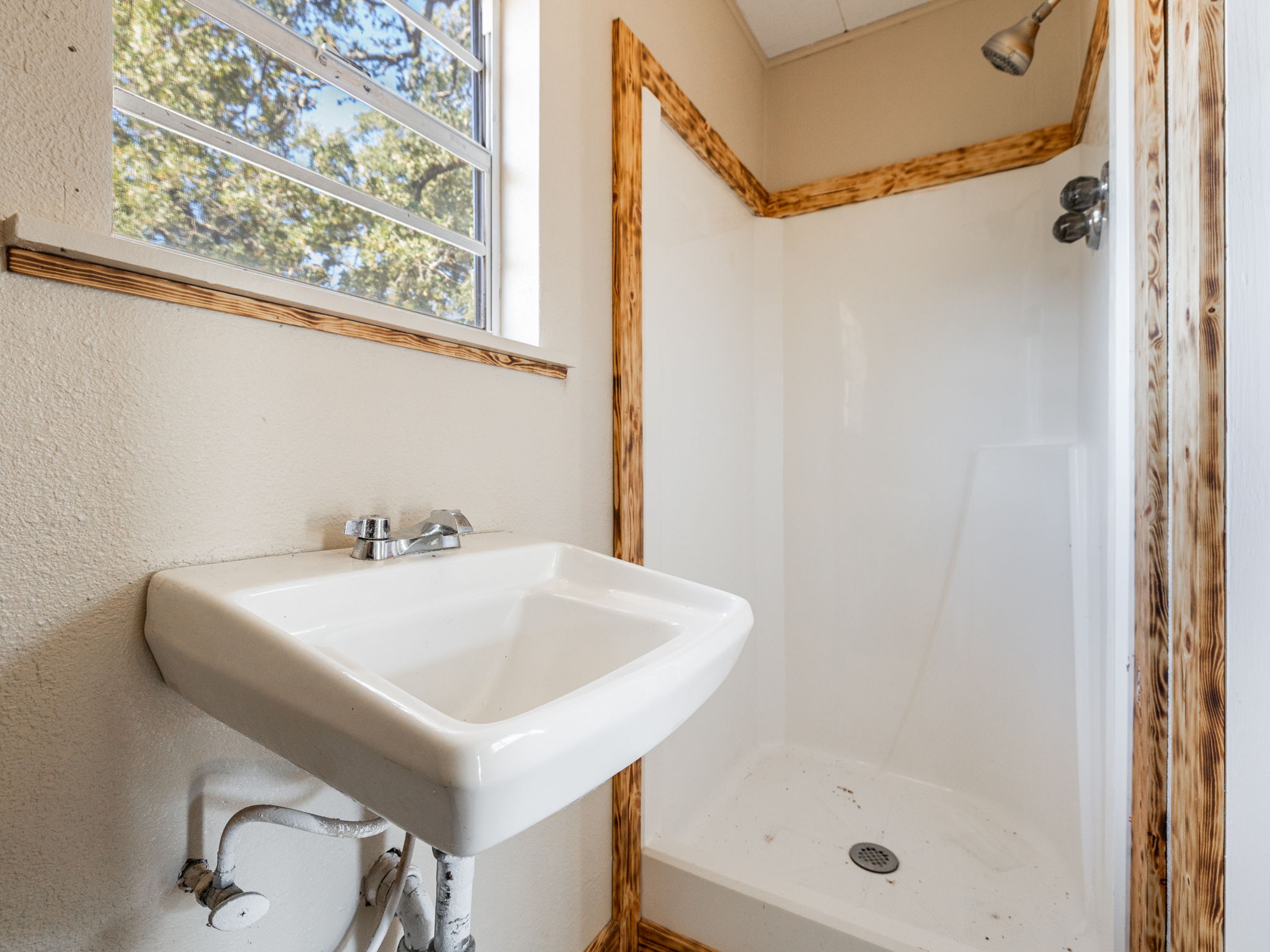 1949 County Road 347 Loop Gause, TX 77857 - Photo 21 of 32 a bathroom with a sink and shower