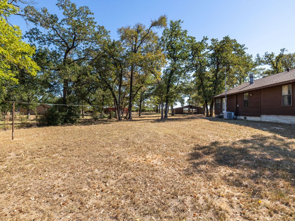 1949 County Road 347 Loop Gause, TX 77857 - Photo 24 of 32 a view of outdoor space with yard