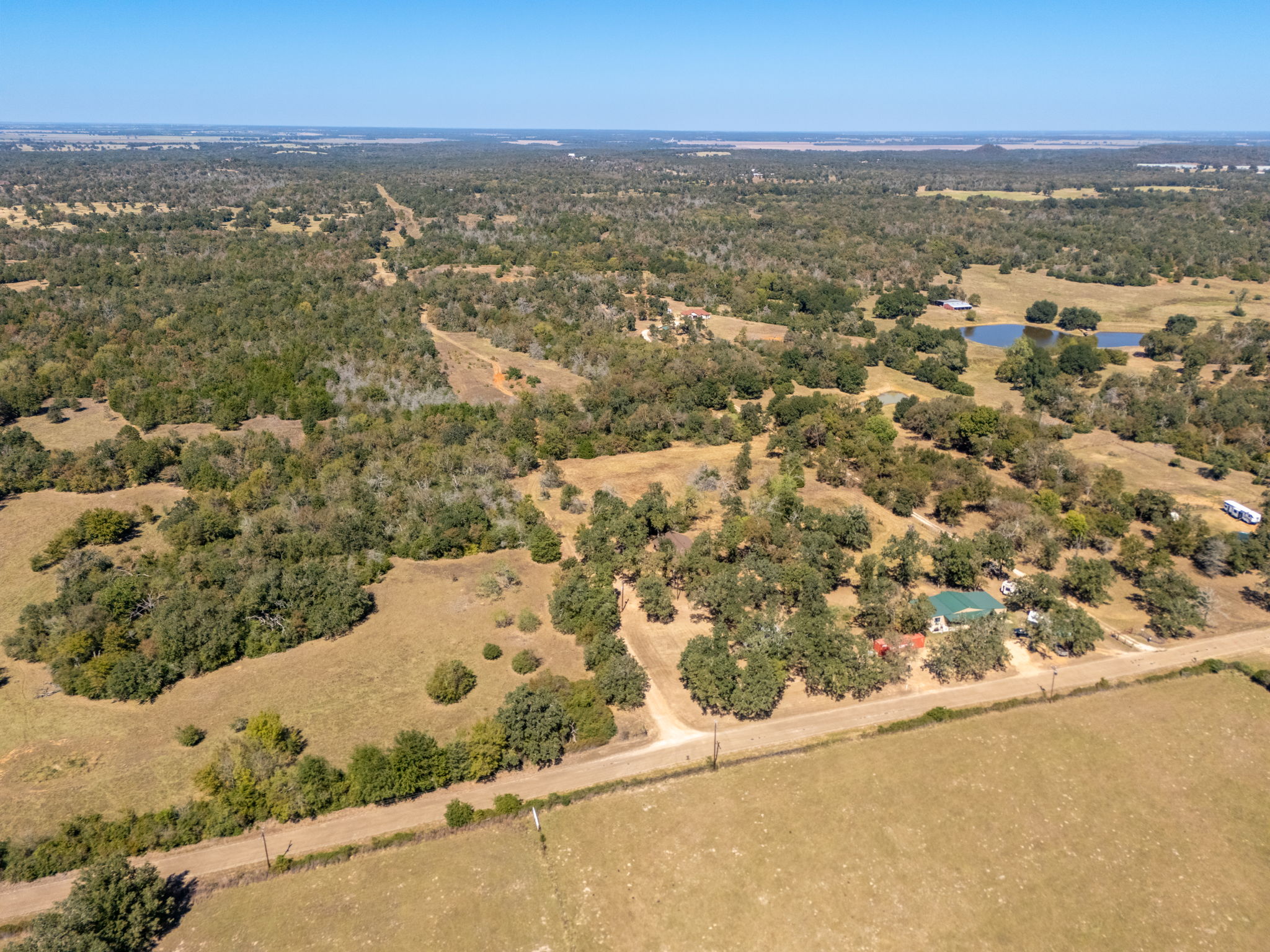 1949 County Road 347 Loop Gause, TX 77857 - Photo 30 of 32 an aerial view of residential houses with outdoor space