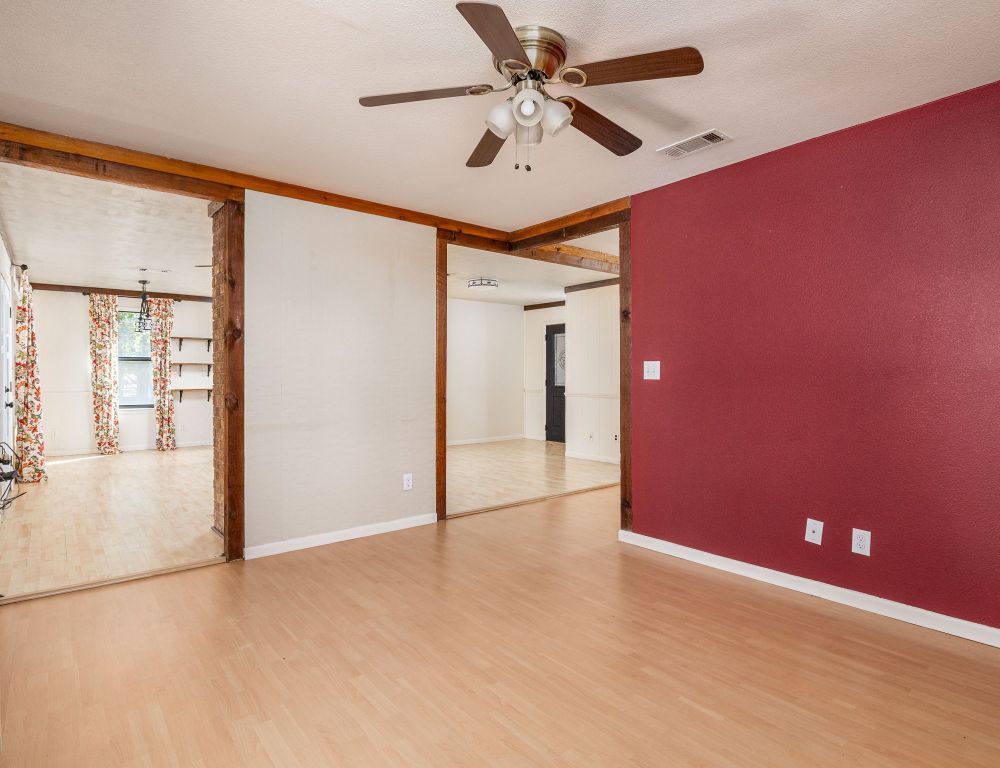 1949 County Road 347 Loop Gause, TX 77857 - Photo 9 of 32 a view of a big room with a chandelier fan and windows