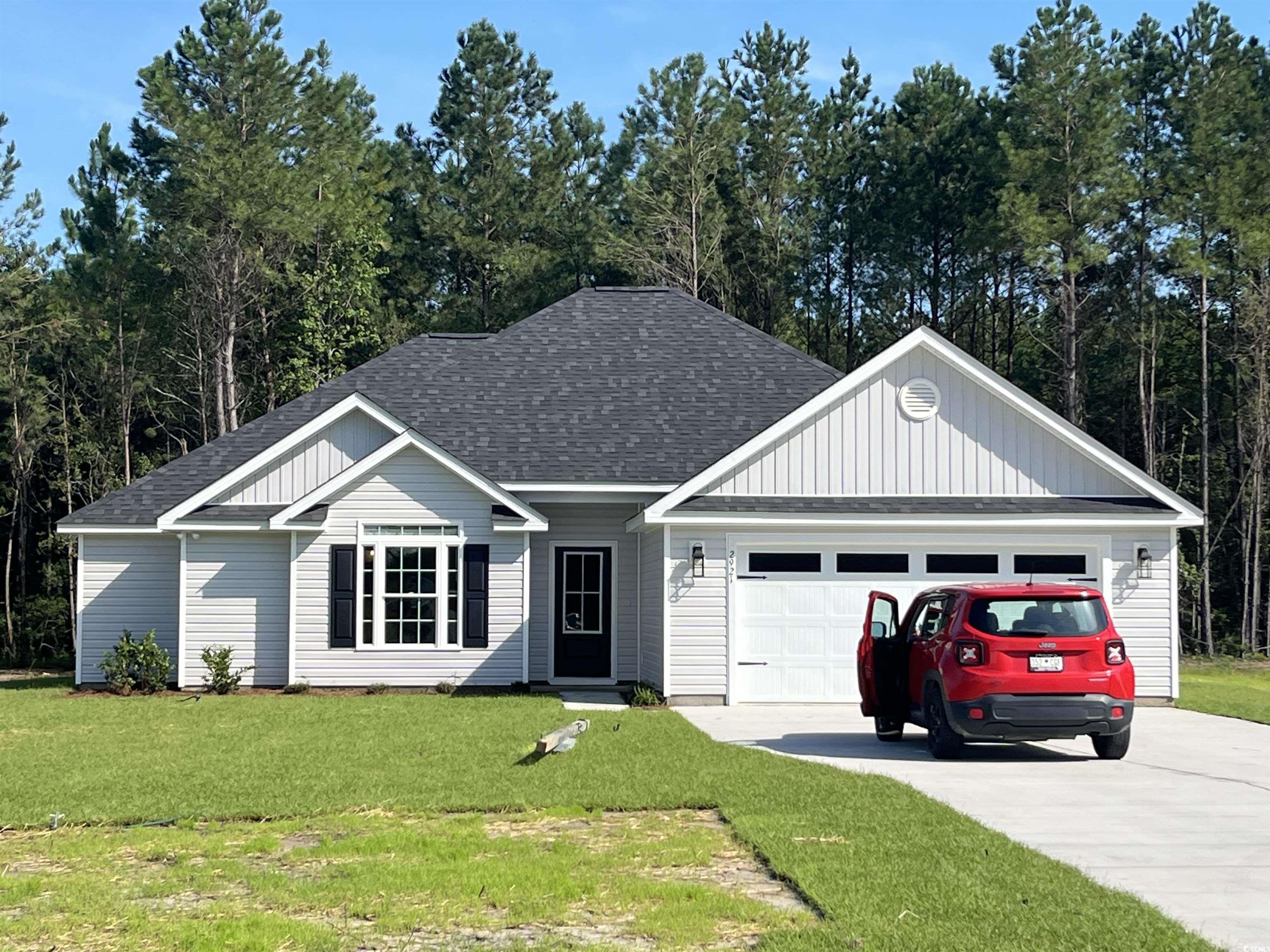 2921 Hughes Gasque Road Aynor, SC 29511 - Photo 1 of 14 View of front of property featuring a shingled roo