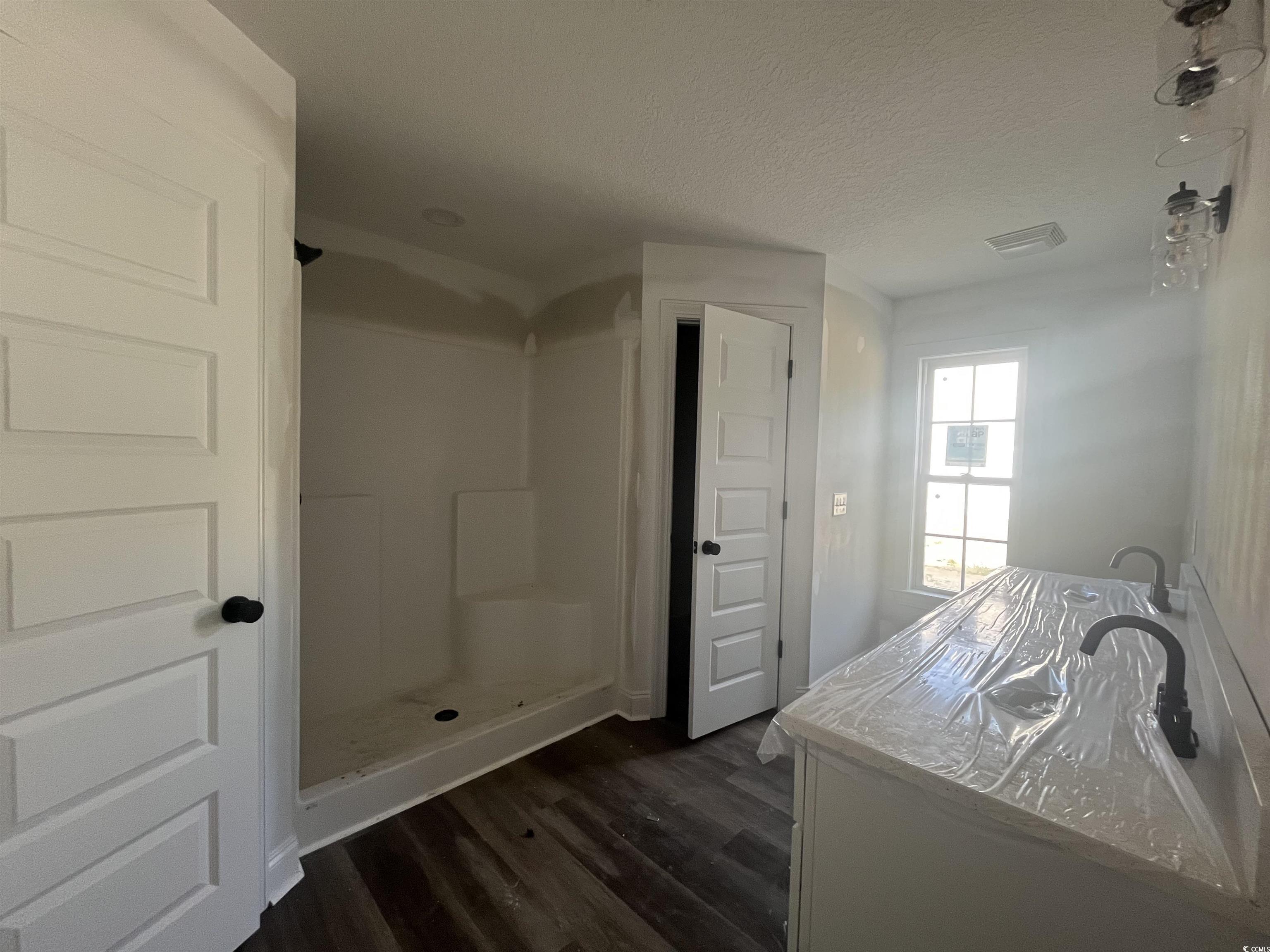 2921 Hughes Gasque Road Aynor, SC 29511 - Photo 11 of 14 Full bathroom featuring wood finished floors, a wa